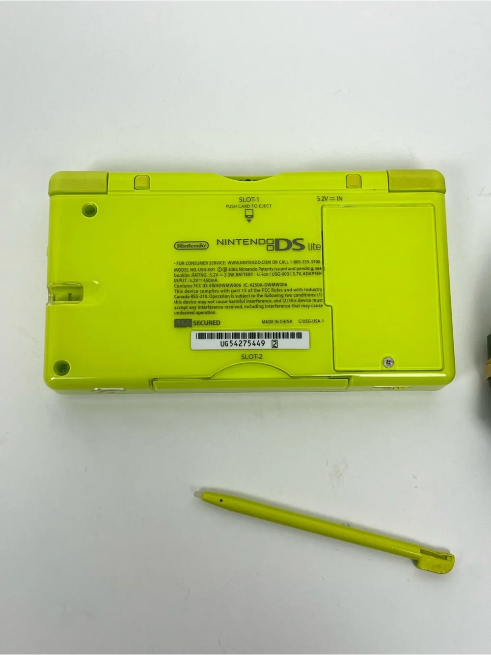 Nintendo DS Lite lime green charging cord and stylus.
